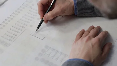 Architect drawing a plan on tracing paper 库存影片 125873008