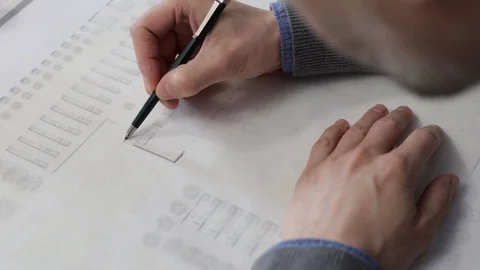 Architect drawing a plan on tracing paper Stock Footage 125873144