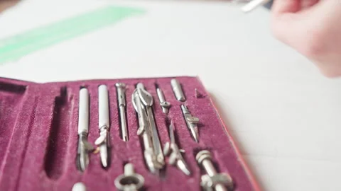 Architect drawing tools set in velvet box with hands demonstrating drafting Vídeo Stock 333843931