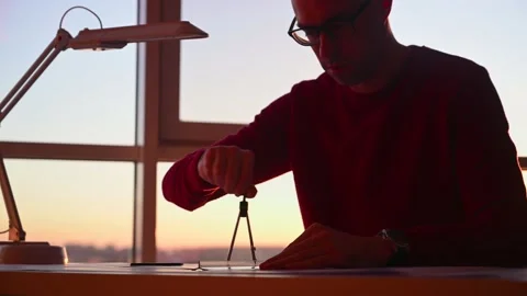 Architect draws blueprints on table Video stock 143415549