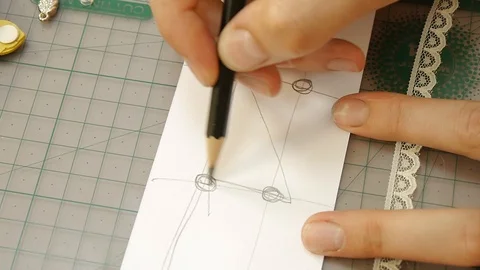 Architect draws a project on a white sheet Stock Footage 119907386