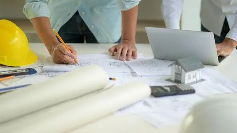 The architect is editing the house plan according to the customer's require.. Foto stock