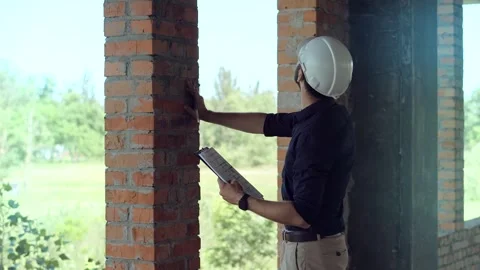 Architect engineer builder. Checking construction Stock Footage 261137104