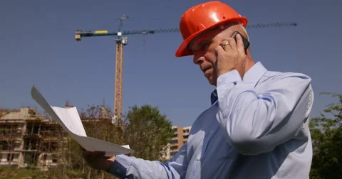 Architect Engineer Check Project  Mobile Phone Call Building Construction Site Stock-Footage 50036615