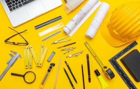 Architect engineer construction site office desk. Project blueprints, hard ha Foto stock