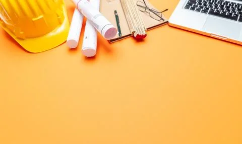 Architect engineer construction site office desk. Project blueprints, yellow Foto stock