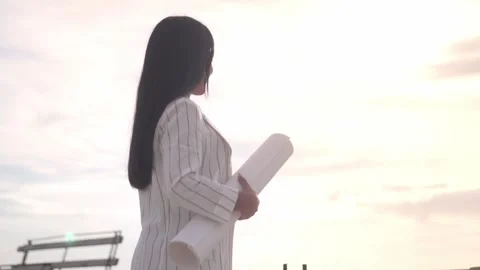 Architect, engineer, designer, clerk, white woman holding drawings Stock Footage 240382032