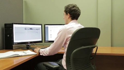 Architect engineer designer on computer with Sketch plans Stock Footage 75944782