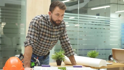 Architect engineer is designing the site of building, house blueprint and layout Stock Footage 145357241