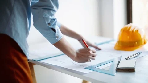 Architect engineer drawing blueprints Stock Footage 75774934