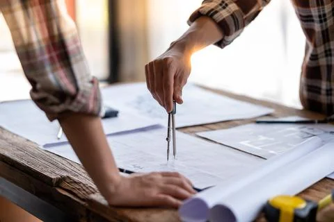 Architect engineer drawing building reconstruction sketch, Engineer design Fotos de archivo