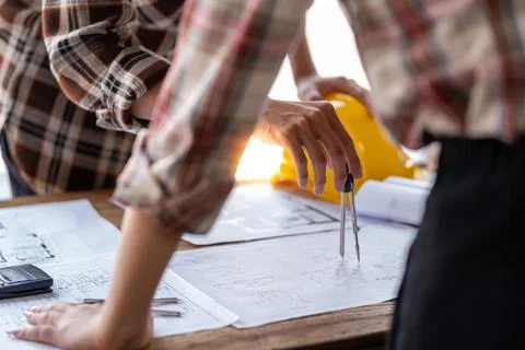 Architect engineer drawing building reconstruction sketch, Engineer design Fotos de archivo