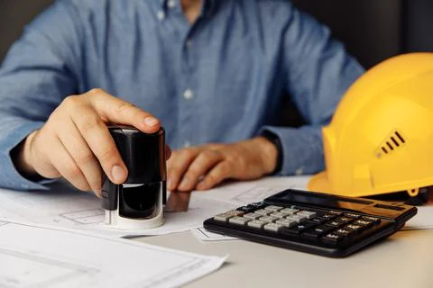 Architect engineer hand hold stamp, building concept Stock Photos