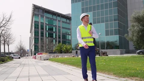 Architect Engineer Observing Construction Site with Project Tube Stock Footage 278645122