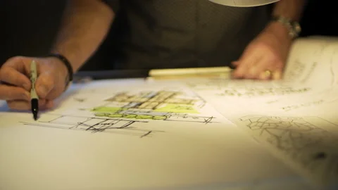 Architect Engineer Sketching Blueprint on Paper - Pan Left Shot (4K UHD) Stock-Footage 235285158