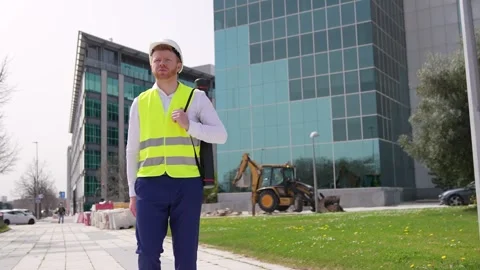 Architect Engineer Smiling with Project Tube at Construction Site Stock-Footage 278645115