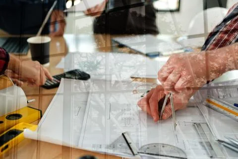Architect engineer team working discussing on house blueprint of real estate  Stock Photos
