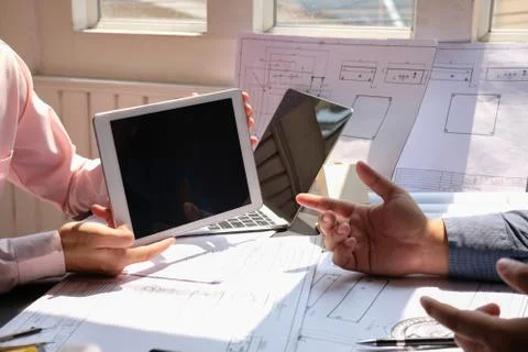 Architect engineer team working on house blueprint of real estate project at  Stock Photos