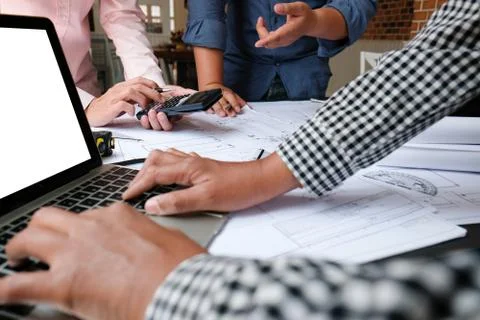 Architect engineer team working on house blueprint of real estate project at  Stock-Fotos