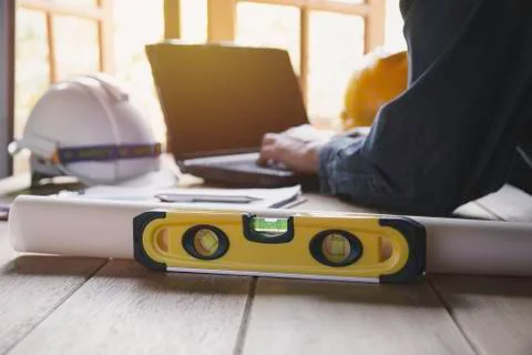 Architect engineer working concept with laptop and construction tools or safe Stock Photos