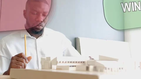 Architect examining model with pencil, adjusting part for plan, causing callouts Stock Footage 333818469