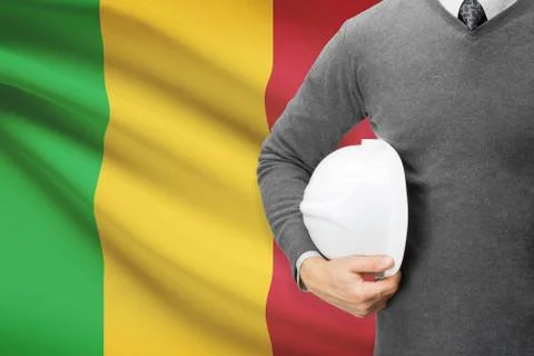 Architect with flag on background  - mali 写真素材