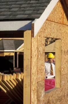 Architect framed through opening on construction site, British Columbia, Canada. Stock Photos