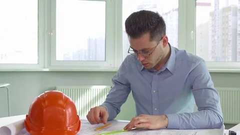 Architect gets tired at the office Stock Footage 73910851