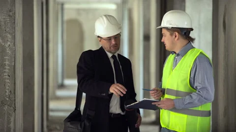 Architect gives task for foreman Stock Footage 65174581