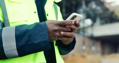 Architect, hands and typing with phone on construction site for communication or Stock Footage 336777486