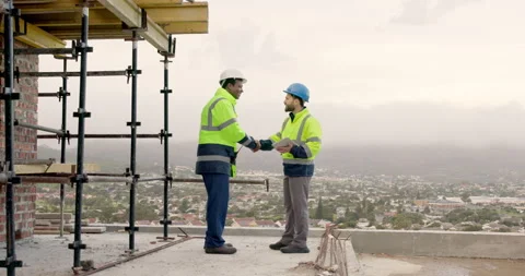 Architect, handshake and men with tablet on construction site, teamwork and Stock Footage 337626553