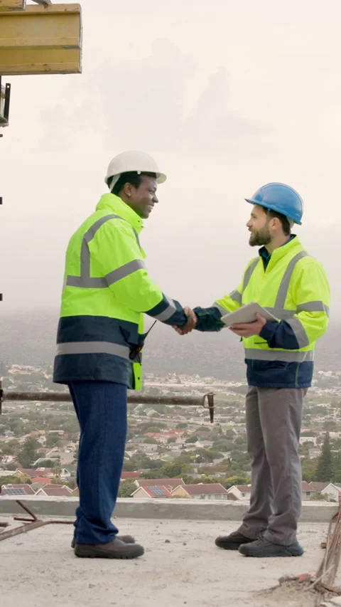 Architect, handshake and team with tablet on building site, talk and property Video stock 338054292