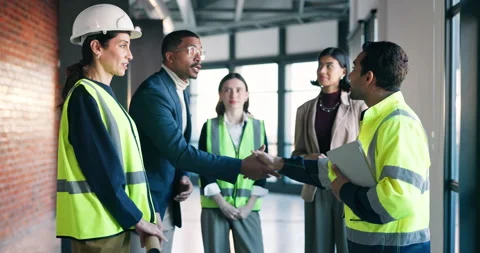 Architect, handshake and team with tablet in meeting, thank you or agreement for Stock Footage 340814448