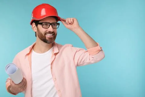 Architect in hard hat with draft on light blue background, space for text Stock Photos