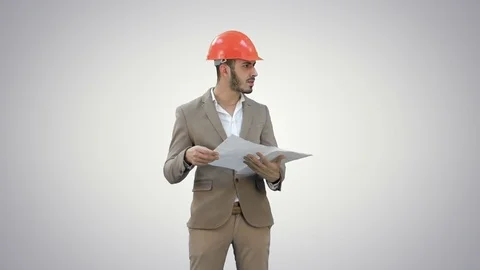 Architect in helmet checking construction plan on white background Vídeo Stock 73632443