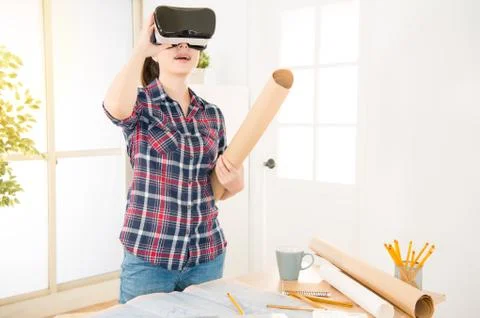 Architect holding paper draft experience VR 스톡 사진