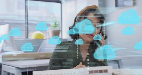 Architect initiating call while overlaying cloud icons and binary code on model Stock Footage 315538993