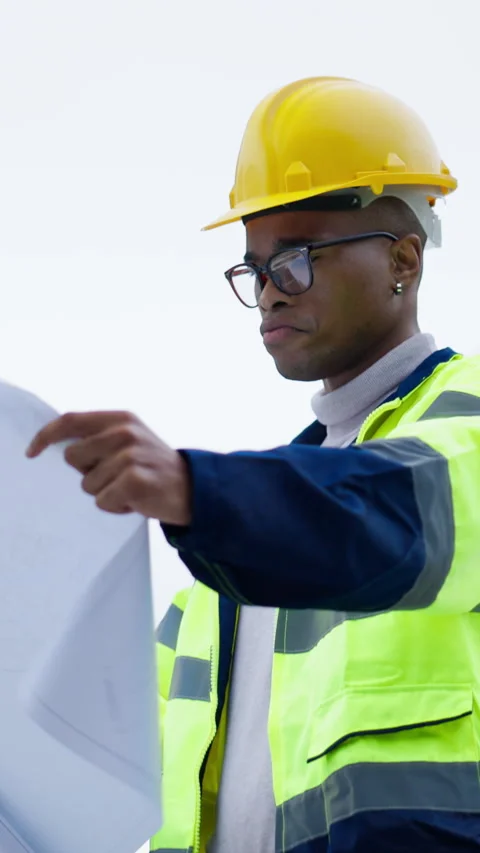 Architect, inspection or black man with blueprint on construction site for Stock Footage 336707362