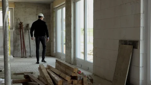 Architect inspects construction from the inside Stock Footage 107558839
