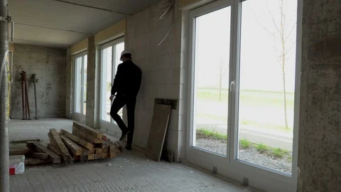 Architect inspects construction from the inside Vídeos de archivo 107560842