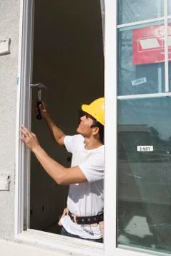 Architect Installing New Window Stock Photos