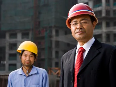 Architect on the job site with a worker. Stock Photos