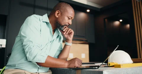 Architect, laptop and black man with documents for building plan, safety or Stock Footage 337764956