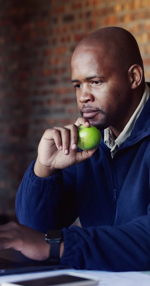 Architect, laptop and snack with black man on construction site for planning or Stock Footage 337022121