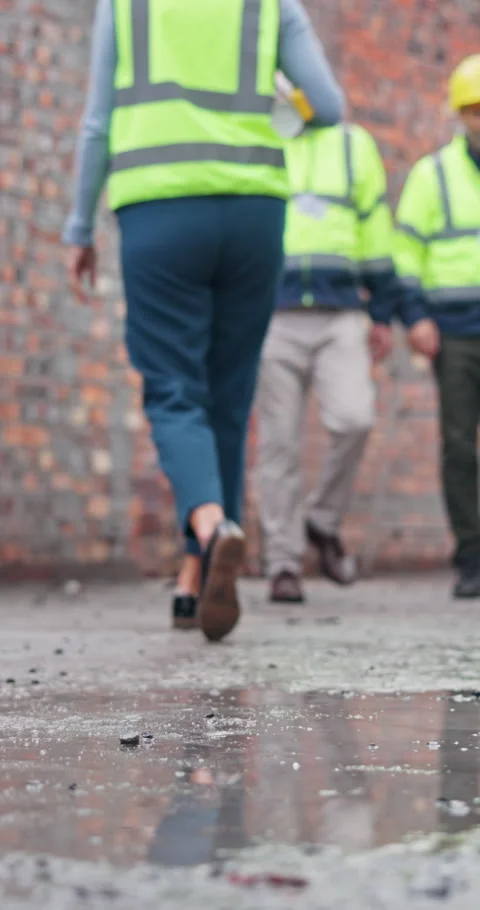 Architect, legs and water on construction site, outdoor and team with project Stock Footage 340984468