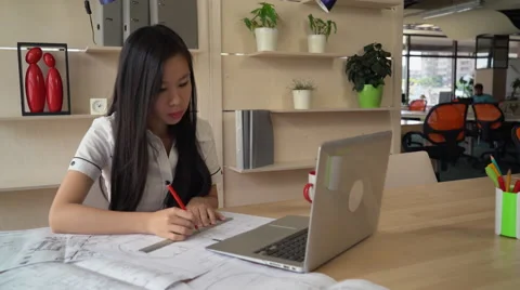 Architect looking and correct design on blueprint at creative office 動画素材 64660286