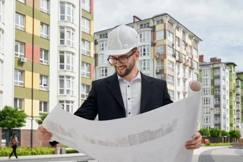 Architect looking at architectural construction drawings. Stock Photos