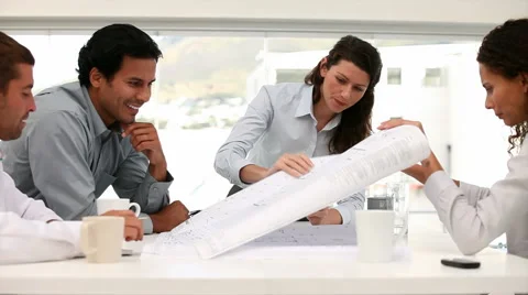 Architect looking at a blueprint map in a meeting Stock Footage 977032