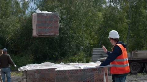 Architect looking at blueprints in a building site Stock Footage 57936609