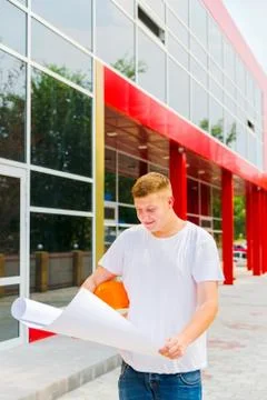 Architect looking at plan on construction site Stock Photos